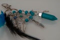 A beautiful keychain with feathers and stones
