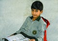 A beautiful kid holding school book