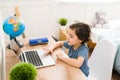 Beautiful kid playing online on the computer Royalty Free Stock Photo