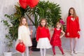 Beautiful kids friends with red balloons in the shape of a heart at the holiday Royalty Free Stock Photo