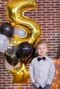 Beautiful kids, little boys celebrating birthday and blowing candles on homemade baked cake, indoor. Birthday party for Royalty Free Stock Photo