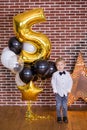 Beautiful kids, little boys celebrating birthday and blowing candles on homemade baked cake, indoor. Birthday party for Royalty Free Stock Photo