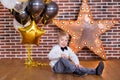 Beautiful kids, little boys celebrating birthday and blowing candles on homemade baked cake, indoor. Birthday party for Royalty Free Stock Photo