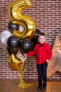 Beautiful kids, little boys celebrating birthday and blowing candles on homemade baked cake, indoor. Birthday party for Royalty Free Stock Photo