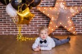 Beautiful kids, little boys celebrating birthday and blowing candles on homemade baked cake, indoor. Birthday party for Royalty Free Stock Photo