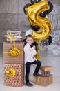 Beautiful kids, little boys celebrating birthday and blowing candles on homemade baked cake, indoor. Birthday party for Royalty Free Stock Photo