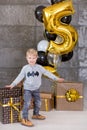 Beautiful kids, little boys celebrating birthday and blowing candles on homemade baked cake, indoor. Birthday party for Royalty Free Stock Photo