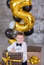Beautiful kids, little boys celebrating birthday and blowing candles on homemade baked cake, indoor. Birthday party for Royalty Free Stock Photo