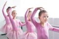 beautiful kids in pink tutu skirts dancing