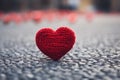 Beautiful Knitted red heart shape on background