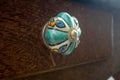 Porcelain knob or handle of a wooden drawer on a old forniture