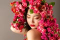 Beautiful korean girl with bright makeup and roses on head