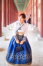 Beautiful Korean woman dressed Hanbok in Gyeongbokgung Palace in Seoul Royalty Free Stock Photo