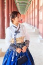 Beautiful Korean woman dressed Hanbok in Gyeongbokgung Palace in Seoul Royalty Free Stock Photo