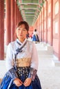 Beautiful Korean woman dressed Hanbok in Gyeongbokgung Palace in Seoul Royalty Free Stock Photo