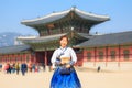 Beautiful Korean woman dressed Hanbok in Gyeongbokgung Palace in Seoul Royalty Free Stock Photo