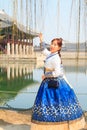 Beautiful Korean woman dressed Hanbok, Korean traditional dress, in Gyeongbokgung Palace Royalty Free Stock Photo