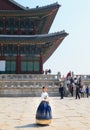 Beautiful Korean woman dressed Hanbok, Korean traditional dress, in Gyeongbokgung Palace Royalty Free Stock Photo