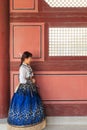 Beautiful Korean woman dressed Hanbok in Gyeongbokgung Palace in Seoul Royalty Free Stock Photo