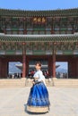 Beautiful Korean woman dressed Hanbok in Gyeongbokgung Palace in Seoul Royalty Free Stock Photo