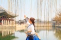Beautiful Korean woman dressed Hanbok, Korean traditional dress, in Gyeongbokgung Palace Royalty Free Stock Photo