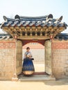 Beautiful Korean woman dressed Hanbok, Korean traditional dress, in Gyeongbokgung Palace Royalty Free Stock Photo