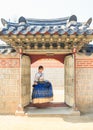 Beautiful Korean woman dressed Hanbok, Korean traditional dress, in Gyeongbokgung Palace Royalty Free Stock Photo