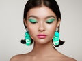 Beautiful Korean Woman with large turquoise earrings