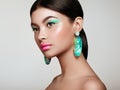 Beautiful Korean Woman with large turquoise earrings