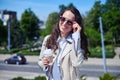 Beautiful lade smiling and drinking coffee