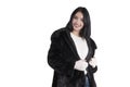 Beautiful lady in a black fur coat, stylish white sweater holiday mittens isolated portrait Royalty Free Stock Photo