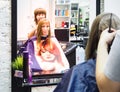 Beautiful lady doing hair in the salon.Hairdresser doing haircut in hairdressing salon. Russia. Saint-Petersburg. The summer of 2