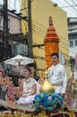 Beautiful lady on the float and The ornately carved beeswax candles paraded around Chiang Rai town. Royalty Free Stock Photo