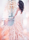 Beautiful lady in gorgeous couture dress in white interior Royalty Free Stock Photo