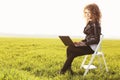 Beautiful lady with her laptop on grass Royalty Free Stock Photo