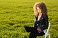 Beautiful lady with her laptop on grass Royalty Free Stock Photo