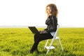 Beautiful lady with her laptop on grass Royalty Free Stock Photo