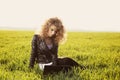 Beautiful lady with her laptop on grass Royalty Free Stock Photo