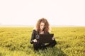 Beautiful lady with her laptop on grass Royalty Free Stock Photo