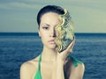 Beautiful lady with large sea shell Royalty Free Stock Photo