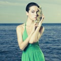 Beautiful lady with large sea shell Royalty Free Stock Photo