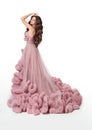 Beautiful Lady in luxury lush pink dress. Fashion brunette woman Royalty Free Stock Photo