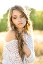 Beautiful lady model in an open field at sunrise