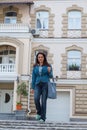 Beautiful lady is near the high-end homes Royalty Free Stock Photo