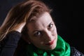 Beautiful lady in neckerchief studio portrait on black background.