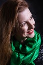 Beautiful lady in neckerchief studio portrait on black background.