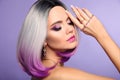 Beautiful lady presents amethyst ring and bracelet jewelry set. Woman portrait with ombre bob short hairstyle and manicured nails