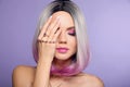 Beautiful lady presents amethyst ring and bracelet jewelry set. Woman portrait with ombre bob short hairstyle and manicured nails Royalty Free Stock Photo
