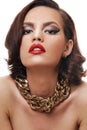 Beauty with red lips and golden jewelry Royalty Free Stock Photo