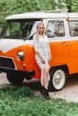 Beautiful lady standing near retro car. Royalty Free Stock Photo